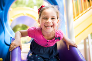 young girl on slide